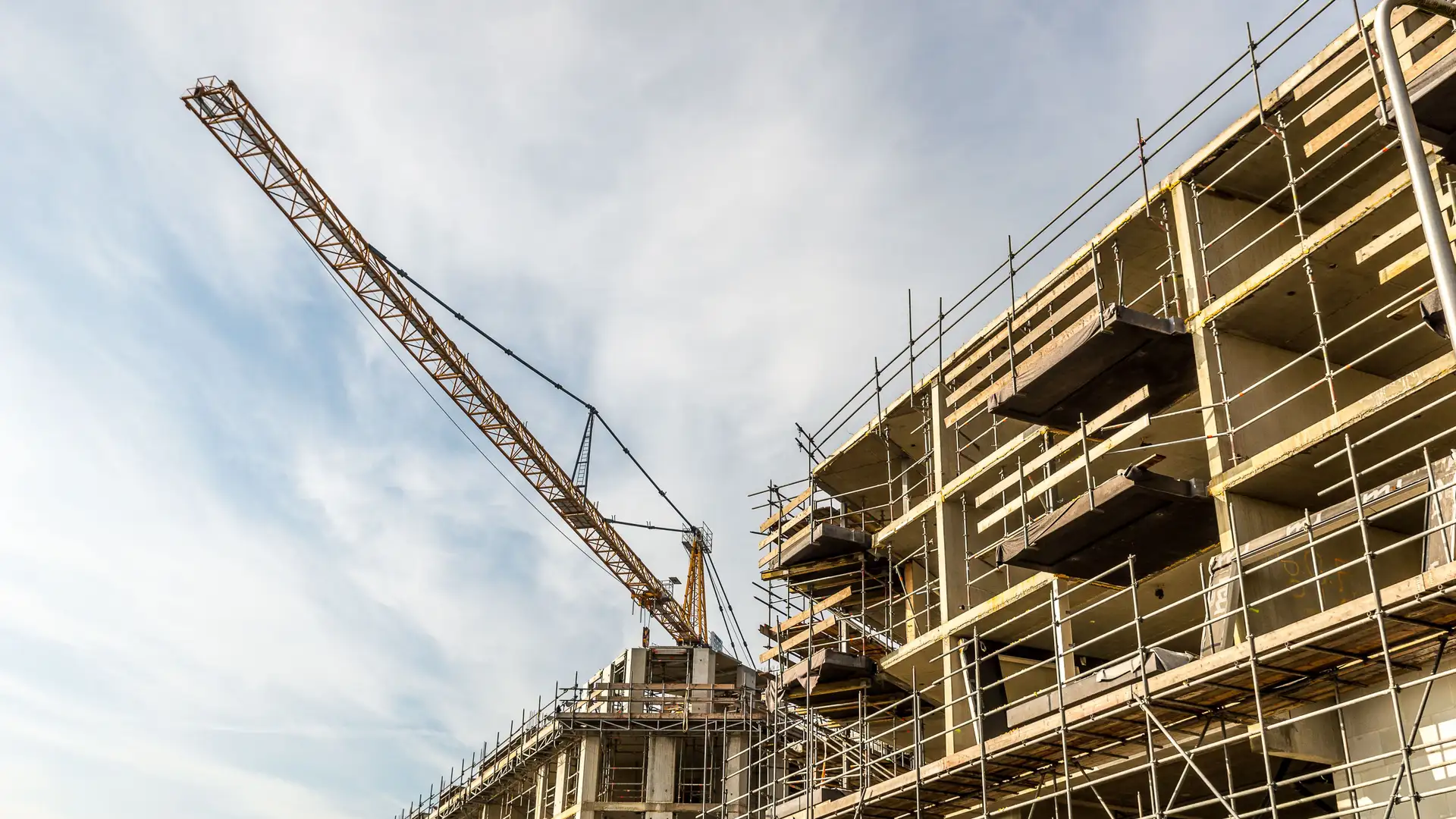 Tower crane and scaffolding on a building under construction